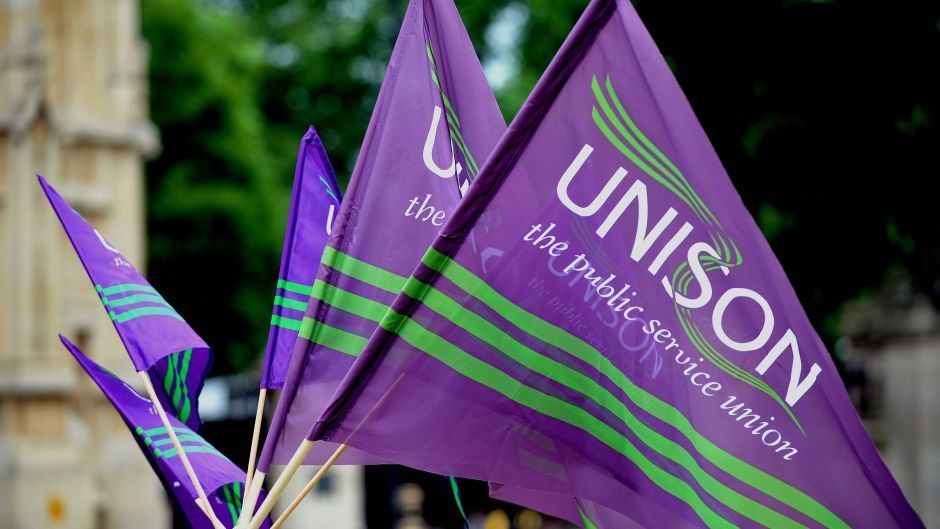 Purple and green Unison flags