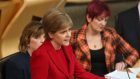First Minister Nicola Sturgeon (centre) delivers a speech outlining her legislative programme for the coming year