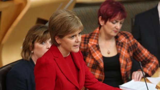First Minister Nicola Sturgeon (centre) delivers a speech outlining her legislative programme for the coming year