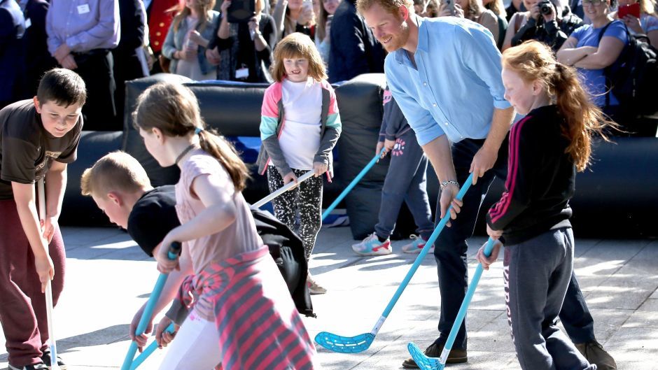 Prince Harry plays hockey with pupils from Kaimhill School