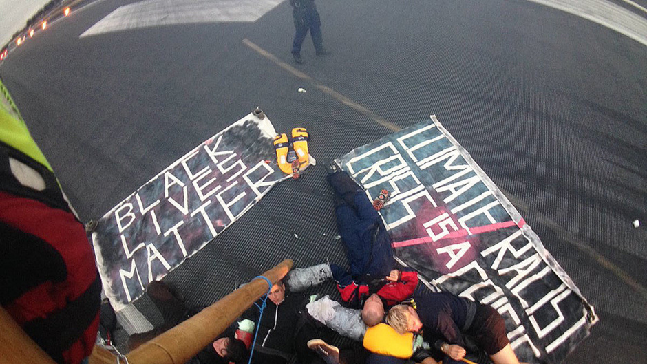 Protesters laid out on the runway (Black Lives Matter/PA)