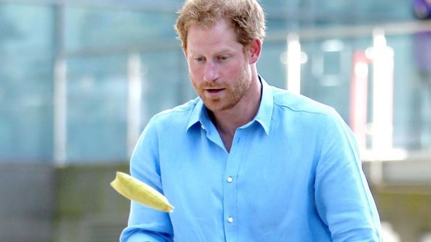 Prince Harry plays bean-bag tennis with pupils from Kaimhill School during a visit to Robert Gordon University in Aberdeen