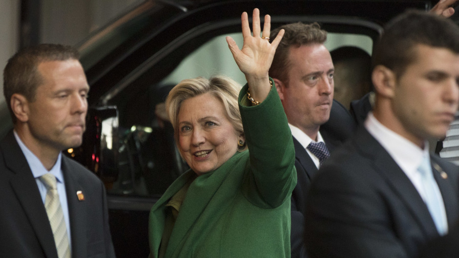 Hillary Clinton waves as she arrives for a meeting with Israeli leader Benjamin Netanyahu in New York (AP)
