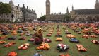 Parliament Square was transformed into a 'graveyard of lifejackets' using 2,500 lifejackets worn by refugees crossing from Turkey