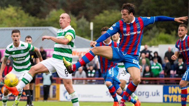 Brad McKay (right) in action against Celtic