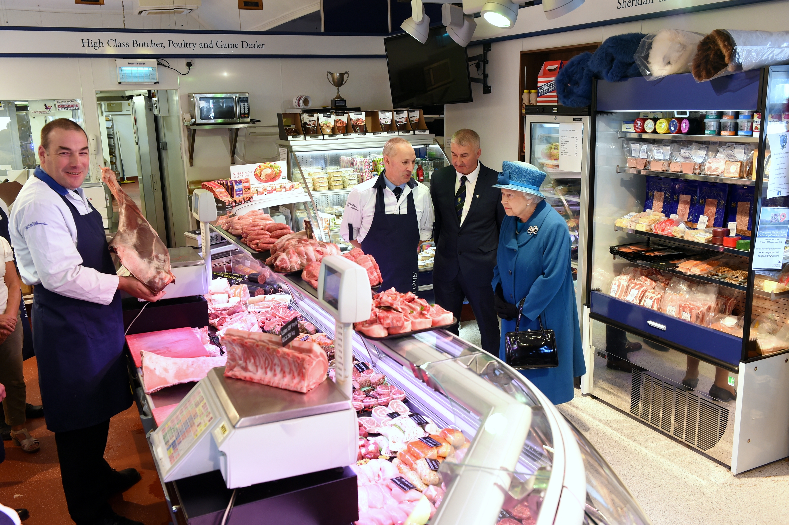 Her Majesty The Queen visits Ballater to meet members of the local community who's homes and livelihoods were affected by flooding during Storm Frank in 2016. Pictured at H.M. Sheridan butchers.  
Pictures by KEVIN EMSLIE