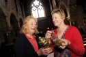 Nicola Irwin, left, and Kath Davies, right, with some of the antiques to be valued at St Margaret's Episcopal Church, Aberlour.
Picture by Gordon Lennox