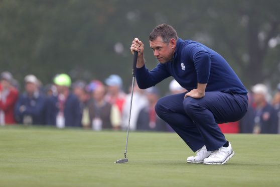 Lee Westwood of Europe lines up a putt