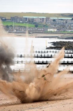 The Royal Navy's bomb squad detonates a mine washed up on Aberdeen beach. (Picture: Kami Thomson).