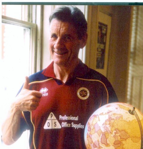 Michael Palin poses in a Stenhousemuir FC shirt.