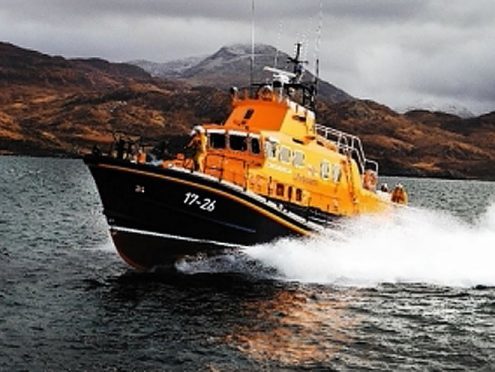 The Mallaig Severn Class Life boat in orange and navy colours out at sea.