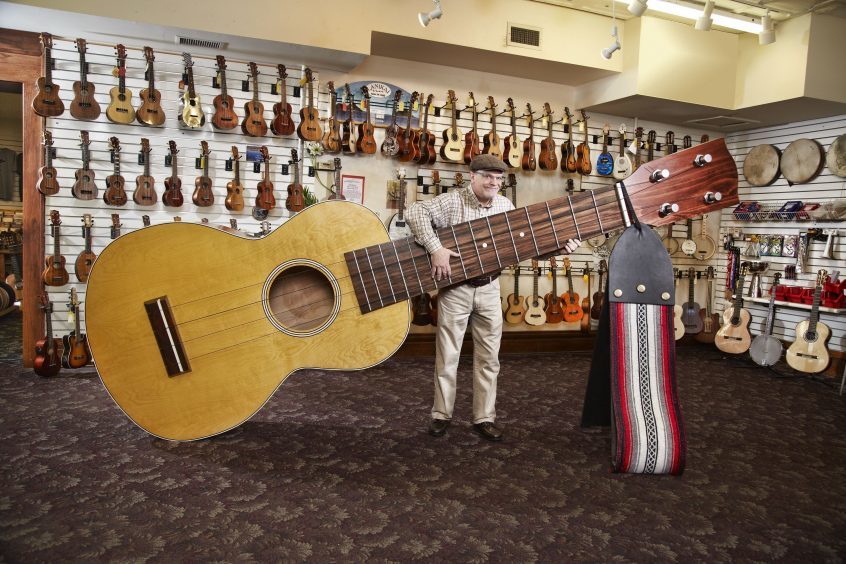 Lawrence Stump with the Largest Ukelele Elderly Instruments, Lansing, MI, USA