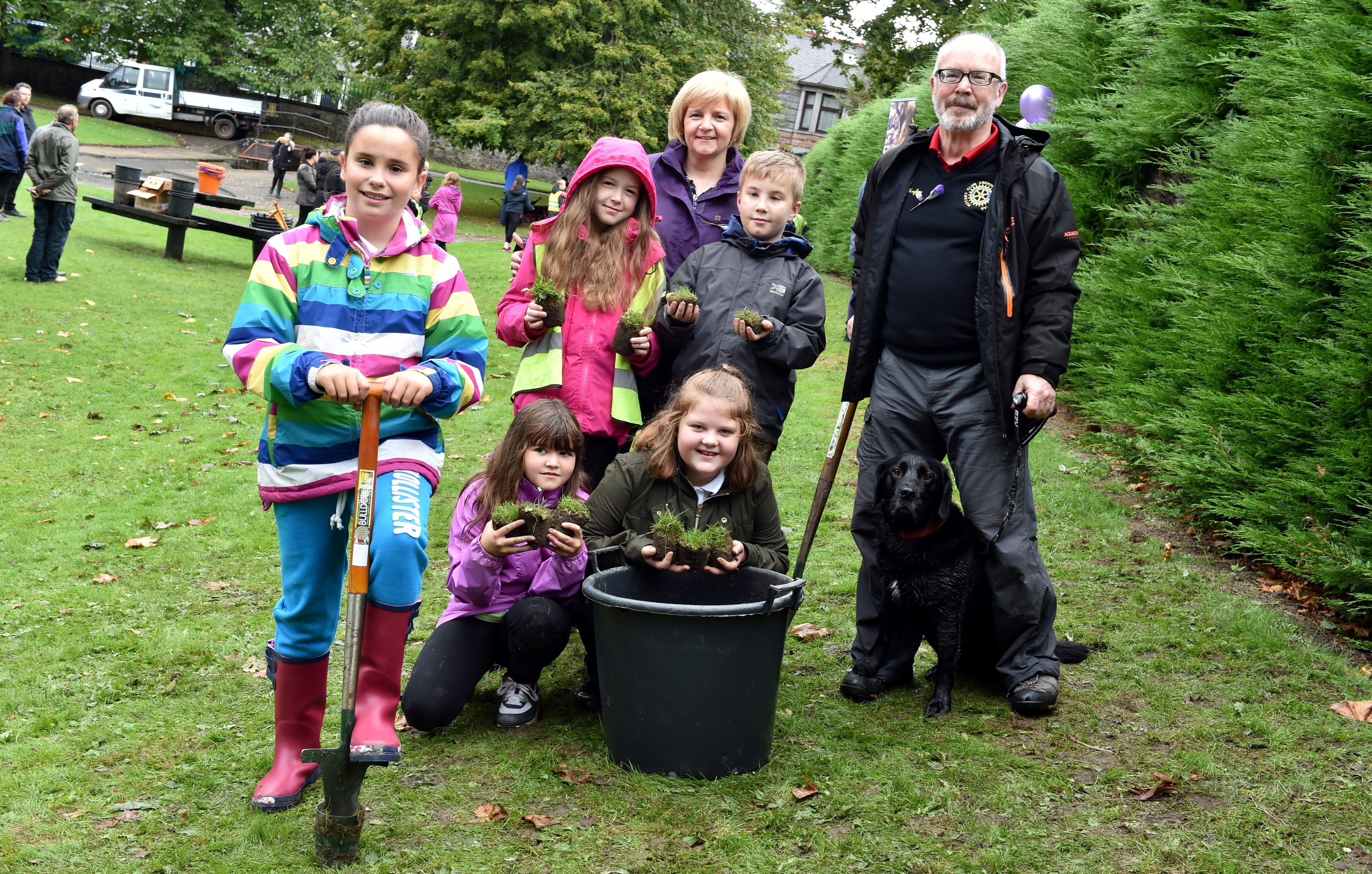 Pictured: Cornhill Primary School pupils L-R front - Gemma Still, Summer Flett, Abbie Shepherd back - Erin Buchan and Marshall Meikle, who helped plant the bulbs with Council leadert Jenny Laing and Rotary Vice President Bob Hughes with his dog Jess.