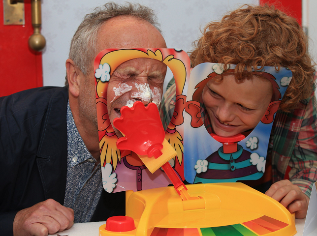 Alan Twigg (left) plays Pie Face Showdown with his son Archie, 11, at Hamleys in London, as it is one of the toy store's predicted top ten sellers for Christmas 2016