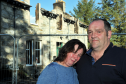 Linda Selvey and partner, Colin Smith,  in front of their burn-out home near Carrbridge. Picture by Gordon Lennox