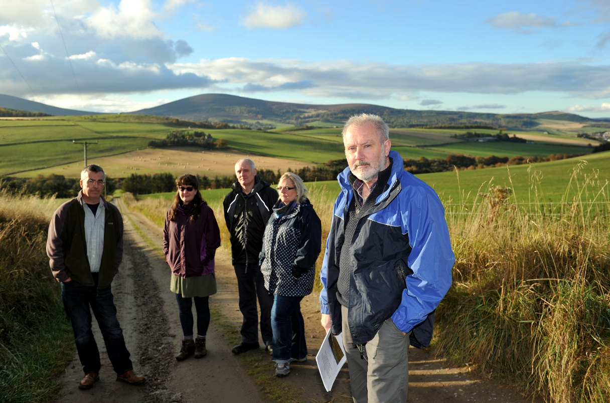 L-R: Rob McHugh, Donna Nash, Joe Nash, Penny Mackenzie, and Colin Mackenzie, on the track to Auchindoun Castle with the view behind that could be threatened by the proposed power line.
Picture by Gordon Lennox