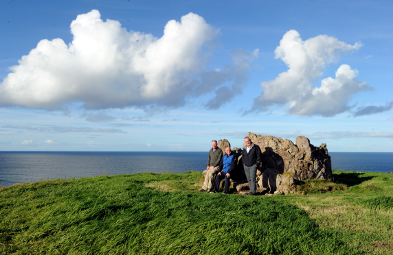 Members of Cullen Past and Present Volunteer Group on Castlehill, Cullen, which has been cleared of gorse enabling people to appreciate the views. L-R: Steve Horrocks, Dennis Paterson, chairman, Barry Addison, secretary. Picture by Gordon Lennox.