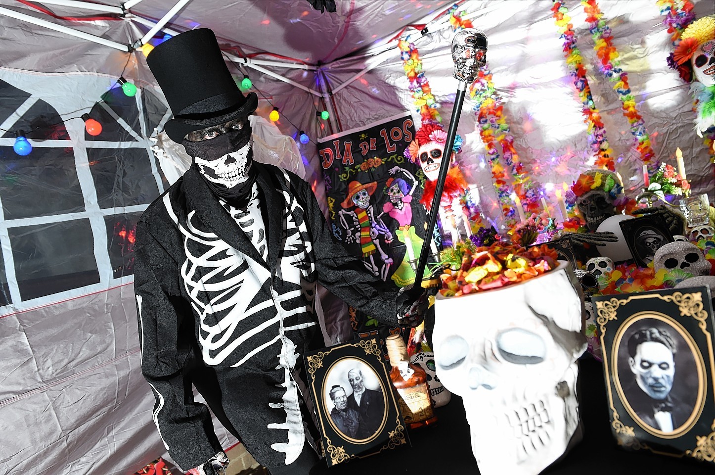 Scott Graham hosting a Halloween party with a Day of the Dead theme