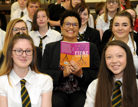 Jackie Kay, National Poet of Scotland, during a visit to Milne's High School, Fochabers, surrounded by S4 and S5 pupils. Picture by Gordon Lennox