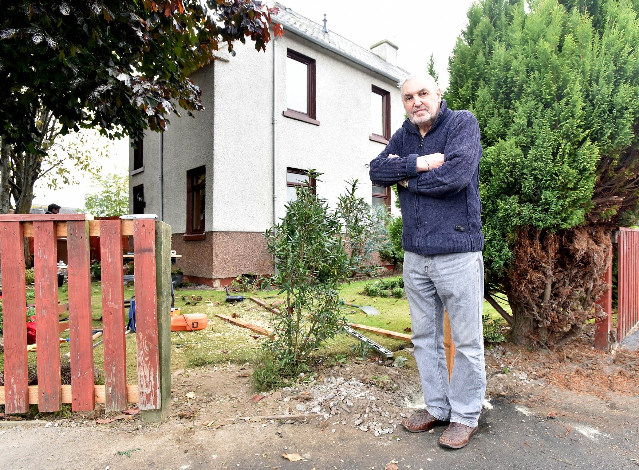 James Lawless at his garden where the van broke through the fence and entered his garden.
