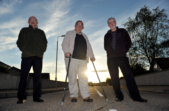Lee Paxton, Robert Murdoch, and John Hamilton, standing in the road at Halliman Way, Lossiemouth. Picture by Gordon Lennox.