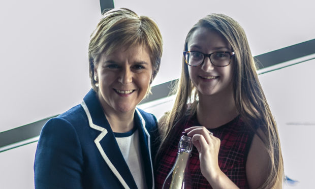 First Minister Nicola Sturgeon handed over a personal letter in a bottle to Emily Plant in Iceland.
