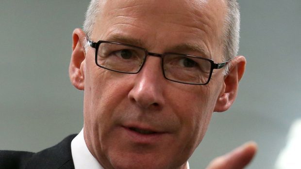 John Swinney will stress it is in the "national interest" for power to to be transferred to local communities