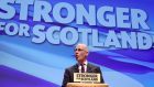 Deputy First Minister John Swinney delivers his speech at the SNP conference in Glasgow