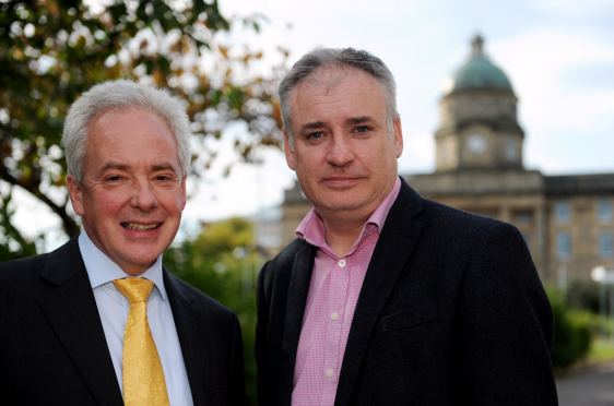 Malcolm Wright, chief executive NHS Grampian, left, with MSP Richard Lochhead, right, beside Dr Gray's Hospital, Elgin, following the talks. 
Picture by Gordon Lennox