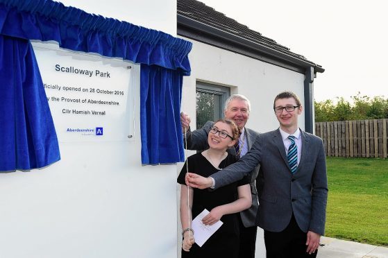 ABERDEENSHIRE PROVOST HAMISH VERNAL OPENS THE NEW CHILDRENS HOME AT SCALLOWAY PARK, FRASERBURGH WITH THE HELP OF RESIDENTS  SHANE HEPBURN AND SASHA ROWLEY.