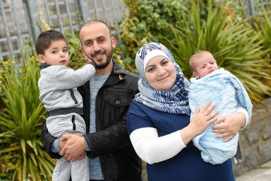 Ibrahim Al Hussein was the first Syrian refugee baby to be born in the north-east. Pictured with father Khalid Al Hussein, mother Fadila and two-year-old brother Shadea outside Aberdeen Town House.