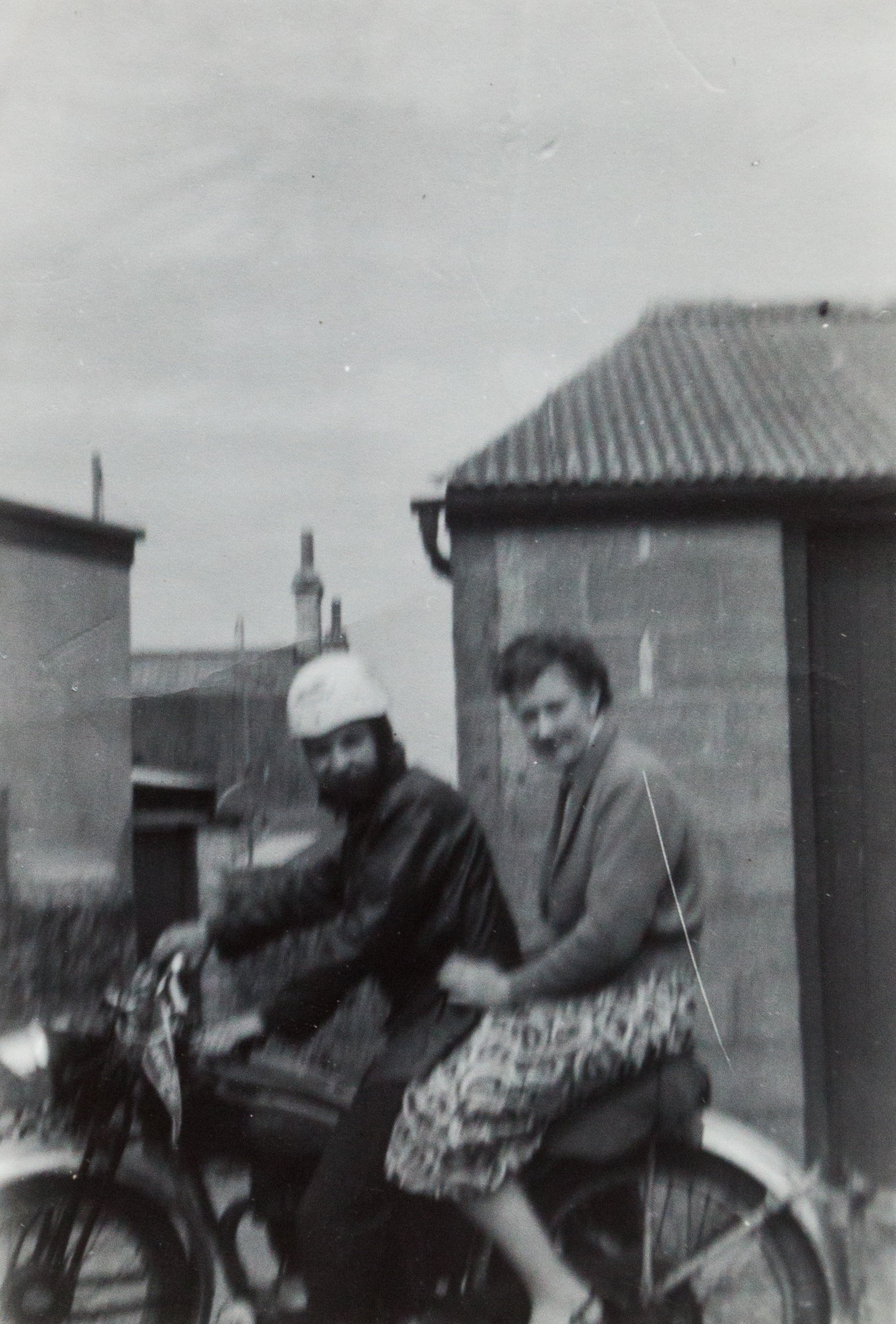 Bob and Jean Smith sitting on their motorbike in 1957 