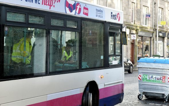 Police activity at a First Bus at Rosemount Place.