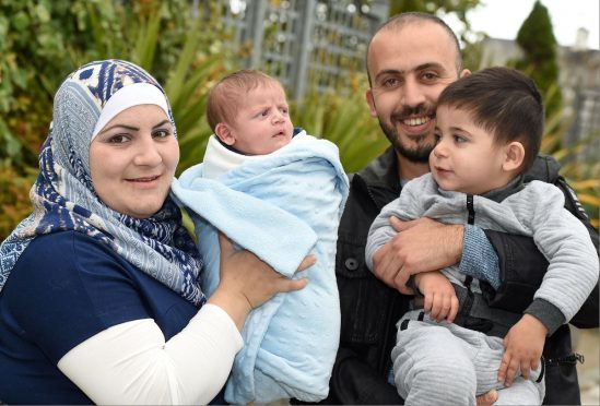 brahim Al Hussein the first Syrian refugee baby has been born in the North-East. Pictured with father Khalid Al Hussein, mother Fadila and brother Shadea (2)