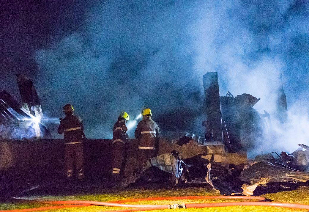 More than 30 firefighters battled a blaze at a north-east car garage
