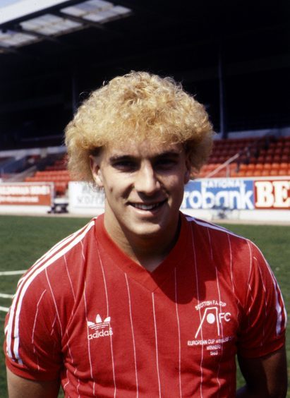 The hair makes it easy to sort out the decade for Neale Cooper.