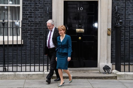 First Minister Nicola Sturgeon leaves after a meeting between Prime Minister Theresa May and the leaders of the three devolved governments at 10 Downing Street