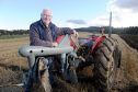 Sandy Allison of Lairg with his 1958 Ferguson Tractor and same vintage disc plough. Pics by Sandy McCook