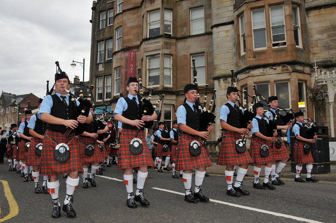 Oban High School pipe band perform a march through the streets of Oban