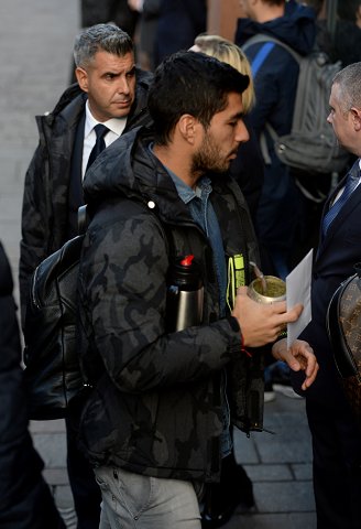 Luis Suarez arrives in Glasgow