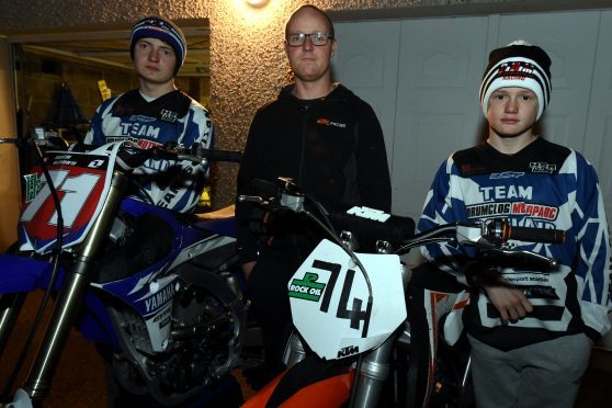 Barry Hendry flanked by his sons, Owen, left and Logan at Kintore after some of their bikes were stolen. 
Picture by Jim Irvine