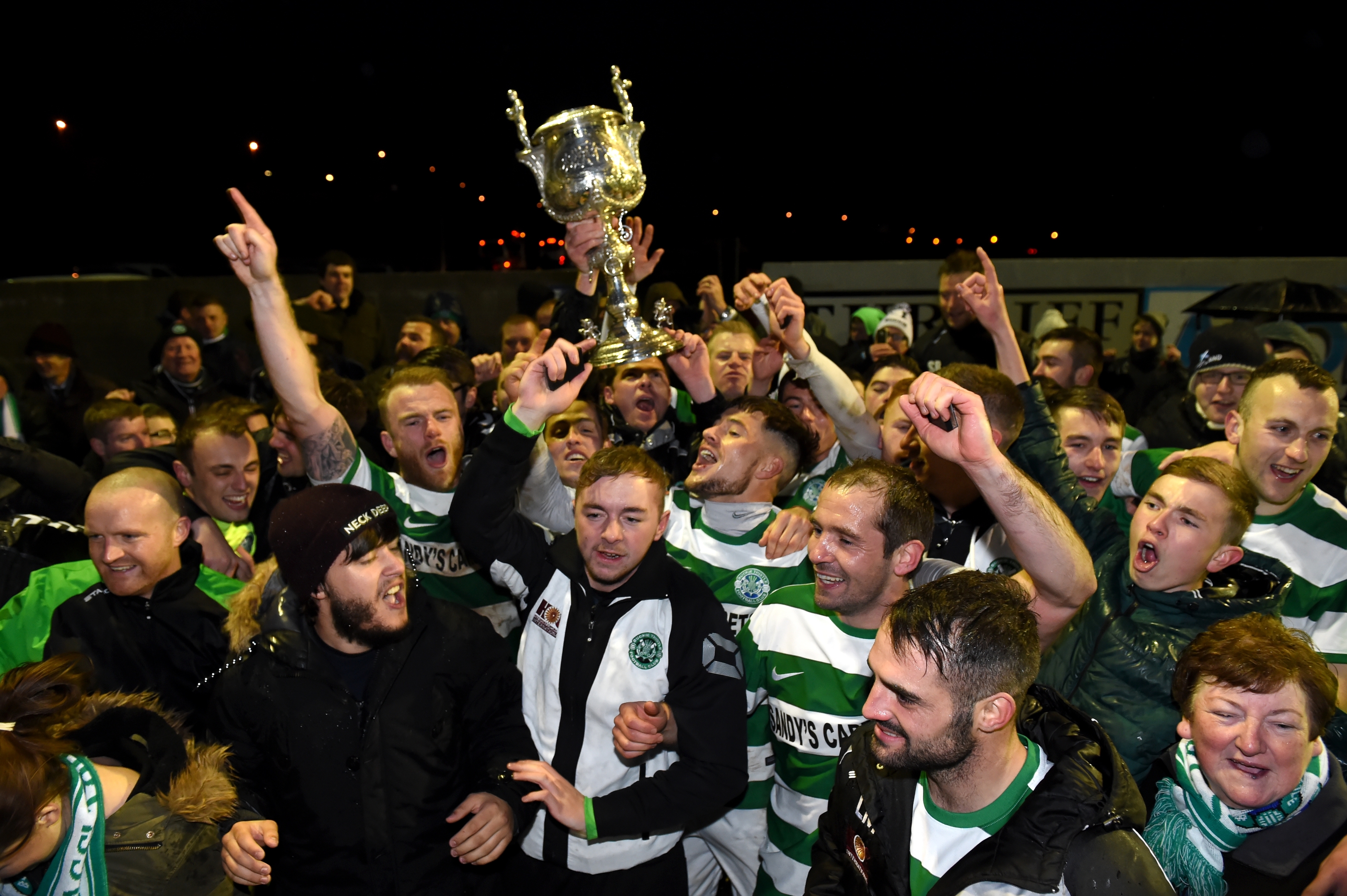 Players and fans celebrating.