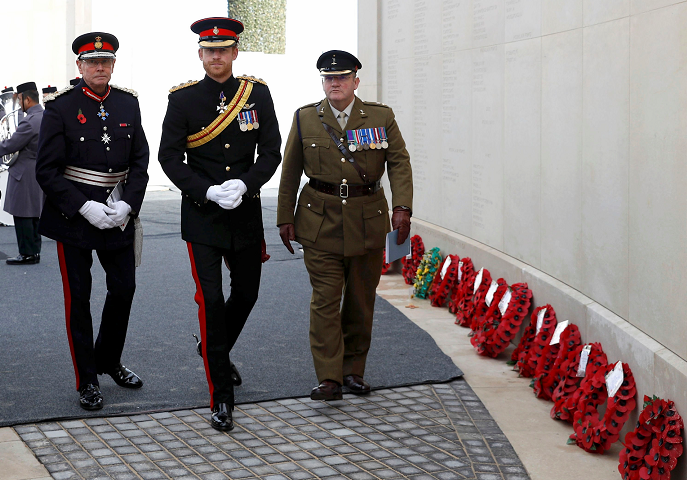 Prince Harry (centre) attends a Service of Remembrance at the Armed Forces Memorial at the National Memorial Arboretum in Staffordshire Darren Staples/PA Wire