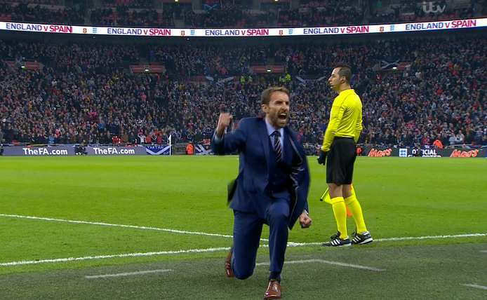 England's interim manager Gareth Southgate goes down on one knee and pumped his fist theatrically as Adam Lallana's header went in during the England v Scotland , European Group F - World Cup Qualifying at Wembley Stadium.
Picture:ITV/ Universal News And Sport
