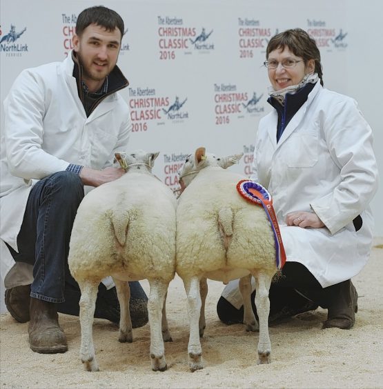 The Smith family with their champion pair of lambs