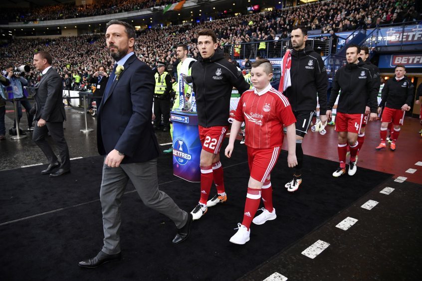 Celtic manager Brendan Rodgers (left) and Aberdeen manager Derek McInnes lead out the teams