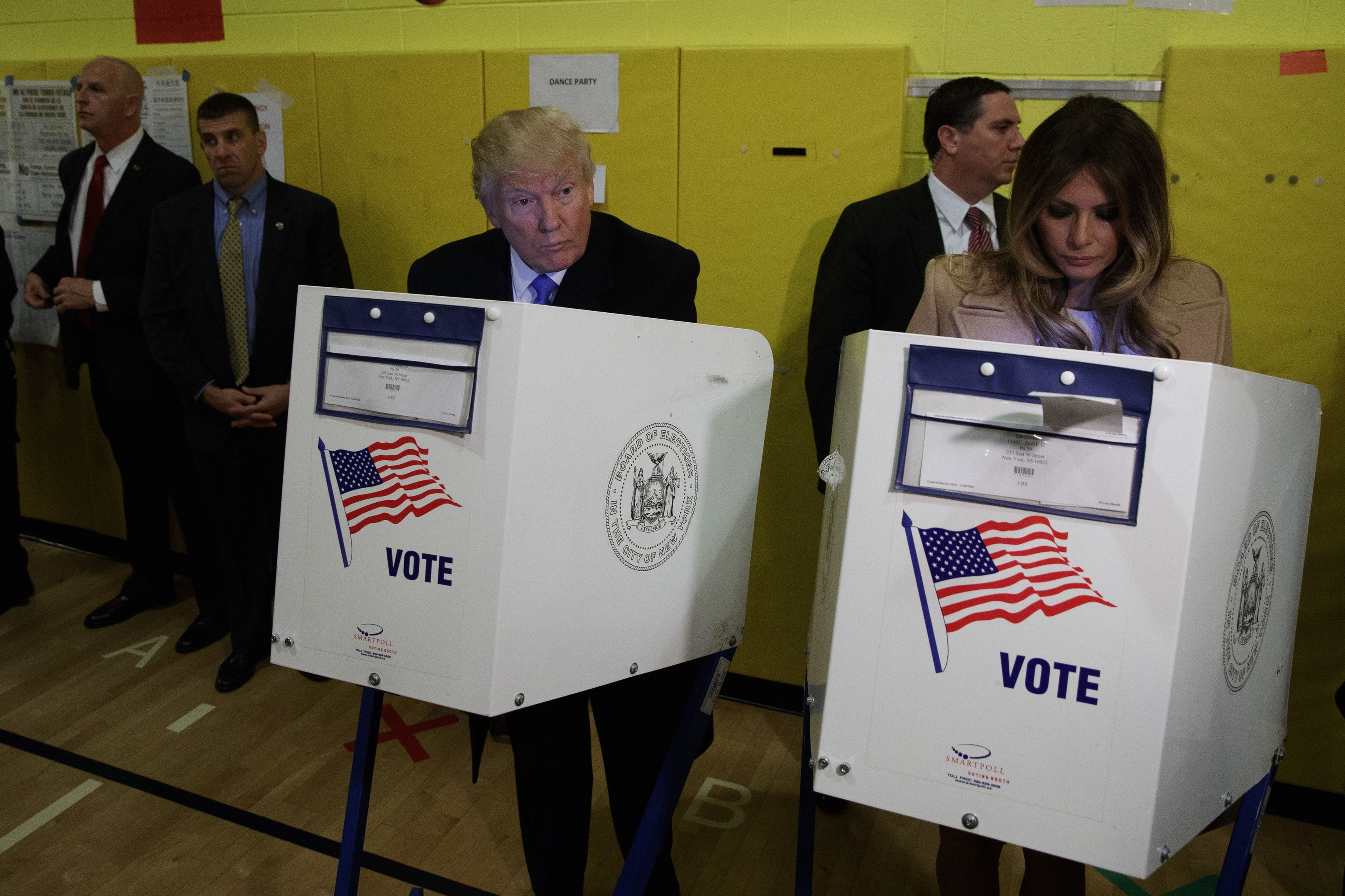 Republican presidential candidate Donald Trump, and his wife Melania, casts their ballots at PS-59, Tuesday, Nov. 8, 2016, in New York. (AP Photo/ Evan Vucci)