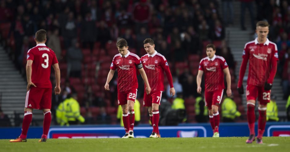 Aberdeen's Ryan Jack and Kenny McLean cut dejected figures after the second goal is scored