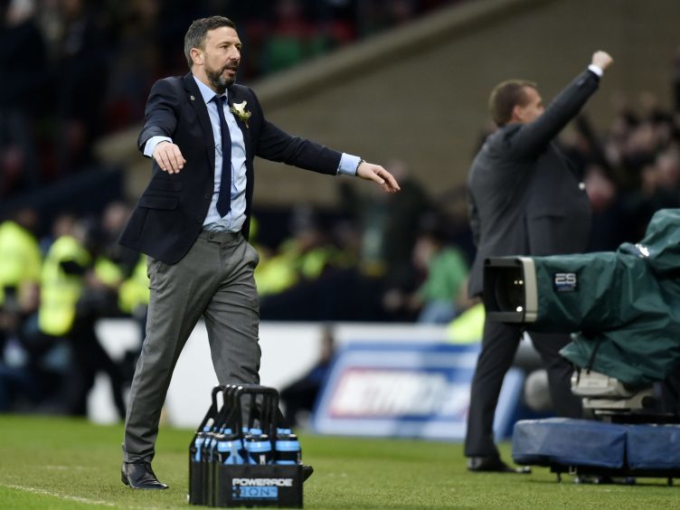Aberdeen manager Derek McInnes stands dejected