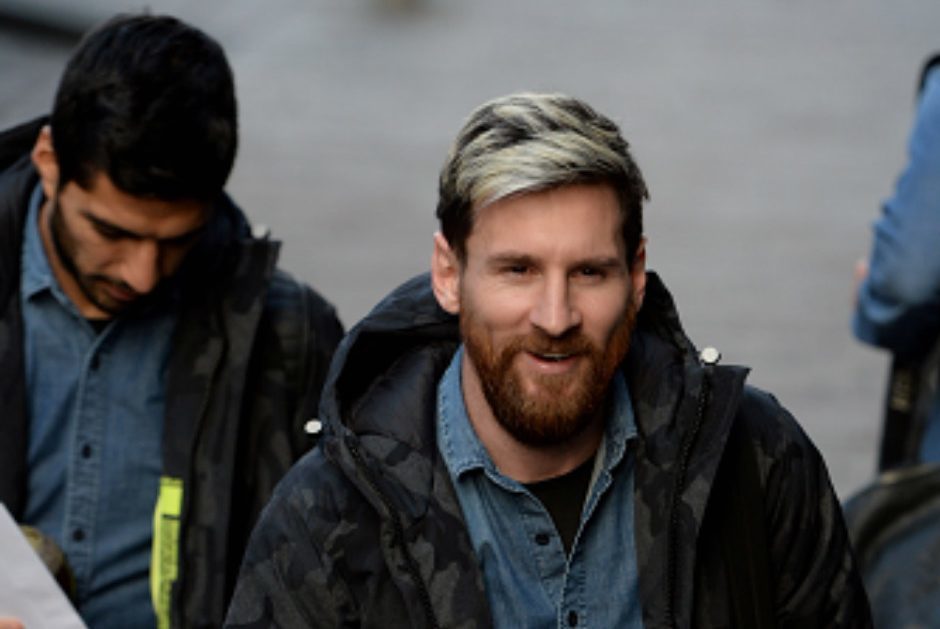 Lionel Messi followed by Lius Suarez of FC Barcelona arrive at a Glasgow city centre hotel